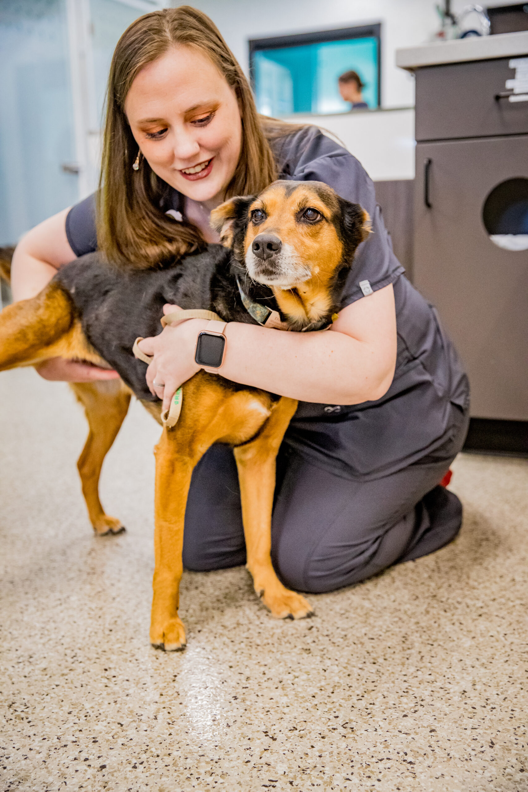 Ridgeview Vet Clinic a person holding a dog